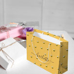 Bridal shower cute happy bumble bees monogram large gift bag<br><div class="desc">Decorated with happy, smiling yellow and black bumble bees. A yellow background. Personalize and add a name. The name is written with a large modern hand lettered style script with swashes. To keep the swashes only delete the sample name, leave the spaces or emoji's in front and after the name....</div>