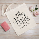 Bride Black Script Personalized Wedding Tote Bag<br><div class="desc">The Bride wedding tote bag features modern black swirling calligraphy script writing with elegant custom first name text that you can personalize for the bride to be. See our coordinating bridal party designs!</div>