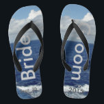 Bride Groom Ocean Waves Blue Sky Flip Flops<br><div class="desc">My Original Photography & Graphic Design. One-of-a-kind Bride Groom flip flops custom designed. Pretty Blue Sky with Fluffy White Clouds, Blue Sea and White Foam Ocean Waves. Unisex Flip Flops with Bride and Groom written in a silver color text, and Date of Marriage in darker grey text. PERSONALIZE with your...</div>