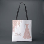 Bride rose gold dress name tote bag<br><div class="desc">Modern and trendy faux rose gold drips,  an elegant dress on a stylish white background.  Text with the Word: Bride written in a dark rose gold hand lettered style script. Perfect as a gift for the bride to be!</div>