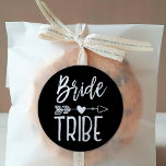 Bride Tribe | Custom Name Black Wedding Classic Round Sticker<br><div class="desc">A customizable black sticker tailored to your trusted bride tribe.  It features a classic black and white themed look with the words bride tribe written in handwritten style font. Between both words is a tribal arrow piercing a heart.</div>