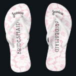 Bridesmaid Beach Wedding | Floral White Lace Pink Flip Flops<br><div class="desc">Personalized, romantic floral lace beach wedding flip flop sandals- Faux vintage style, floral white lace on feminine pink background. Name of bridesmaid at top in curved, elegant style, script letters. Bridesmaid is printed down the middle in modern lettering. Change to fit bridal party members, such as bride, flower girl or...</div>