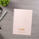 Bridesmaid blush pink notebook<br><div class="desc">A blush pink background color.  Personalize and add your bridesmaid's name.  Golden handwritten style script.</div>