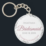 Bridesmaid Elegant Wedding Gift Dusty Rose Keychain<br><div class="desc">These keychains are designed to give as favors to bridesmaids in your wedding party. They feature a simple yet elegant design with a white background, dusty rose or mauve pink & Gray text, and a silver faux foil floral border. Perfect way to thank your bridesmaids for being a part of...</div>