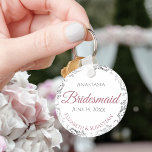 Bridesmaid Elegant Wedding Gift Dusty Rose Keychain<br><div class="desc">These keychains are designed to give as favors to bridesmaids in your wedding party. They feature a simple yet elegant design with a white background, dusty rose or mauve pink & Gray text, and a silver faux foil floral border. Perfect way to thank your bridesmaids for being a part of...</div>