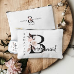 Bridesmaid Flower Letter Boho Floral Personalized Accessory Pouch<br><div class="desc">Bridesmaid accessory bag to personalize for your bridesmaid. Bridesmaid is lettered with neutral boho floral letters and handwritten script. You can also add the name of the bride and groom and their wedding date, which frames a co-ordinating floral ampersand. Lovely wedding party keepsake gift and perfect for a fall wedding,...</div>