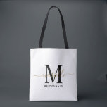 Bridesmaid Gift Gold Monogram White Tote Bag<br><div class="desc">This Bridesmaid tote bag features a handwritten white and black script typography monogram with swashes on a dusty rose background. Present your bridesmaids with a tote for carrying items the day of the wedding,  and traditionally presented at the rehearsal dinner or before.</div>