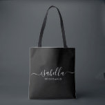 Bridesmaid Gift Personalized Black Tote Bag<br><div class="desc">This Bridesmaid accessory bag features a handwritten white script typography with swashes on a black background. Present your bridesmaids with a tote bag for small items traditionally presented at the rehearsal dinner,  for use in the early morning before the wedding.</div>