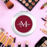 Bridesmaid Initial and Name Burgundy Compact Mirror<br><div class="desc">A personalized compact mirror for your wedding bridesmaid or maid of honor that has her initial and name on a trendy,  burgundy wine color background. Edit to replace initial and name. Select your compact mirror style. Customize further to change font styles and sizes if desired.</div>