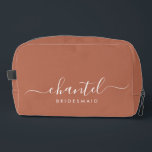 Bridesmaid Modern Script Cosmetic Terracotta Dopp Kit<br><div class="desc">This Bridesmaid accessory bag features a handwritten white script typography with swashes on a terracotta background. Present your bridesmaids with a toiletry bag for their makeup and small items traditionally presented at the rehearsal dinner,  for use in the early morning before the wedding.</div>