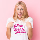 Bridesmaid Team Bride Pink Bachelorette T-Shirt<br><div class="desc">The Bridesmaid Team Bride Pink Bachelorette T-Shirt is a fun and retro-inspired essential for your bride squad. Featuring a playful pink script with "Team Bride Forever, " this shirt can be personalized with each bridesmaid's name, making it the perfect wedding party gift. Ideal for bachelorette parties, this stylish and cheerful...</div>