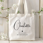 Bridesmaid Wedding Simple Modern Script Name Tote Bag<br><div class="desc">Bridesmaid Wedding Simple Modern Calligraphy Script Personalized Name Tote Bags features your bridesmaid's name in elegant black calligraphy script accented with a simple love heart with the addition of your custom text such as the date and bridemaid. Text and heart colors can be adjusted in the editor to suit your...</div>