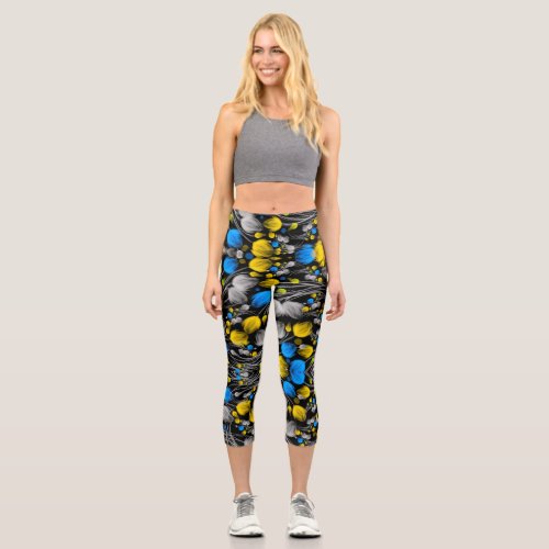 Bright abstract floral pattern on black background capri leggings