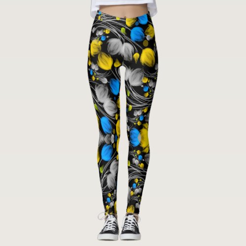Bright abstract floral pattern on black background leggings
