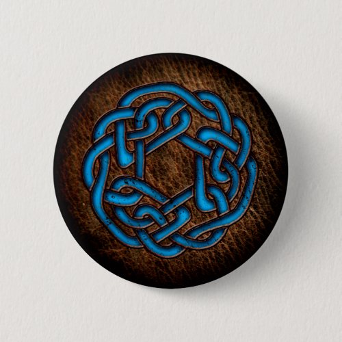 Bright blue celtic ornament on leather button