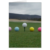 bright colored Golf Balls on a mountain (Front)