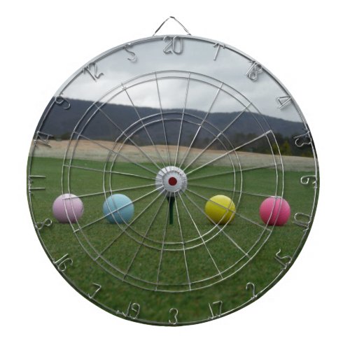 bright colored Golf Balls on a mountain Dart Board