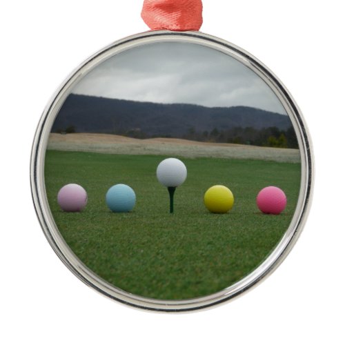 bright colored Golf Balls on a mountain Metal Ornament