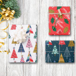 Bright Colorful Boho Christmas Trees Pattern Wrapping Paper Sheets<br><div class="desc">This is fun Holiday season gift wrap that will brighten up any space in your home! The theme is boho style pattern Christmas trees, paired with holly leaves, frosty mistletoe sprigs, and gold pine cones. The background colors of the separate sheets are white, dark teal blue, and bright red orange....</div>