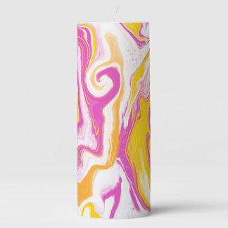 Bright colorful swirls in hot pink and orange pillar candle
