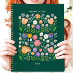 Bright Folk Art Floral Custom Name Planner<br><div class="desc">This cheerful design features a vibrant folk art-inspired floral pattern with colorful blooms in shades of pink, purple, orange, and white against a deep green background. The personalized name and year add a unique touch, making it perfect for students, professionals, or anyone who loves playful and artistic designs. Ideal for...</div>
