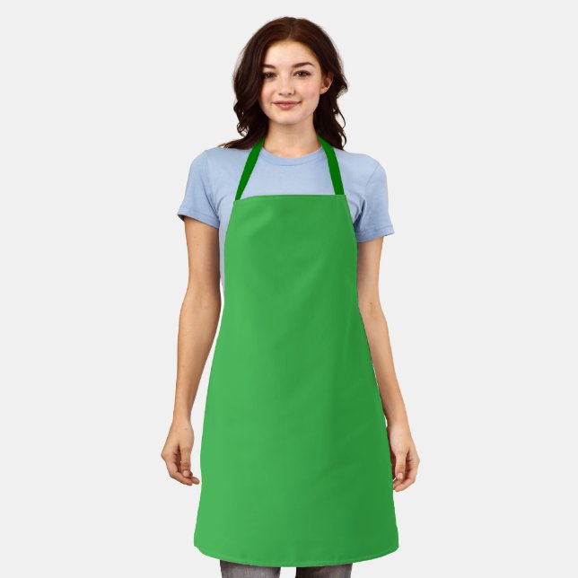 bright green apron with a simple, practical design (Worn)