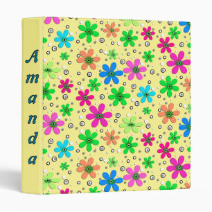 Bright multi-colored chamomile flowers on a yellow 3 ring binder