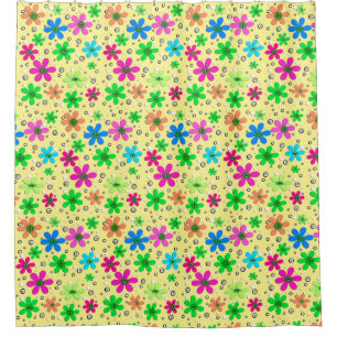 Bright multi-colored chamomile flowers on a yellow shower curtain