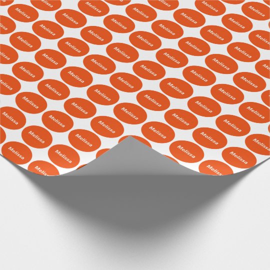 bright orange dots on white wrapping paper