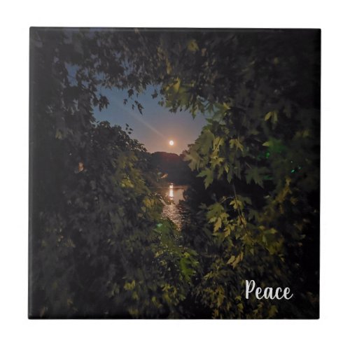 Bright pink moon glow over calm water ceramic tile