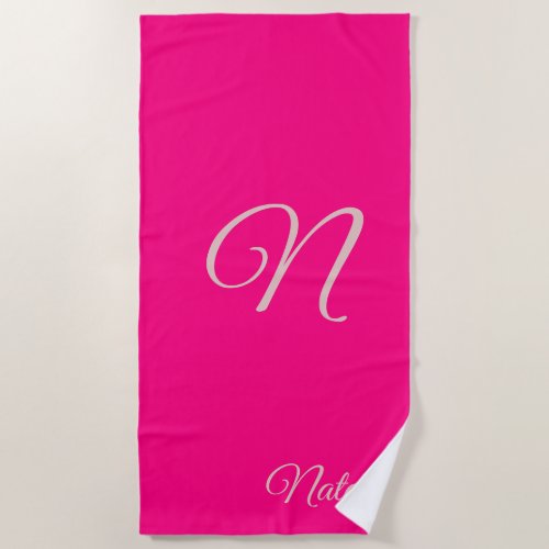 Bright pink solid color monogrammed beach towel