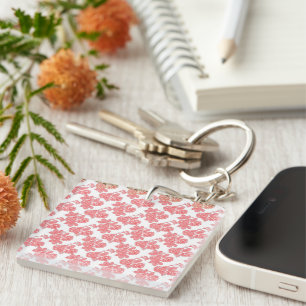 Bright red and pink floral wrapping paper featurin keychain