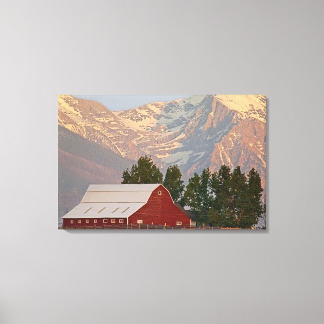 Bright red barn against Mission Mountains in Canvas Print (Front)