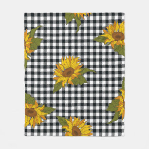 Bright sunflowers on a black and white buffalo che fleece blanket