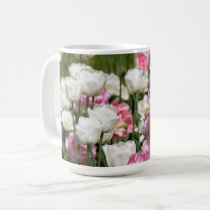 Bright white and pink tulips on a sunny coffee mug