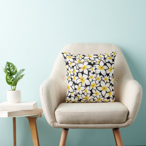 Bright yellow and white frangipani art on black throw pillow