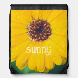 Bright yellow flower after rain drawstring bag