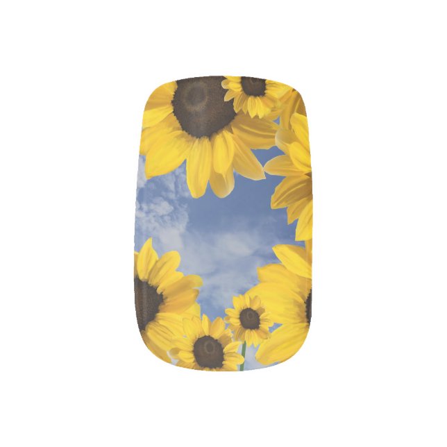Bright yellow sunflowers in blue sky with clouds minx nail art (Left Thumb)