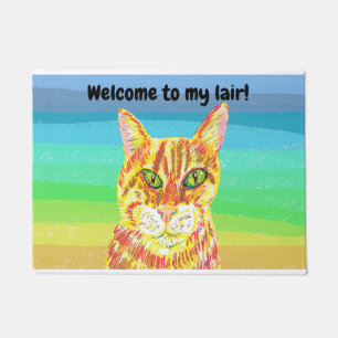 Brightly colored ginger cat welcome to my lair doormat