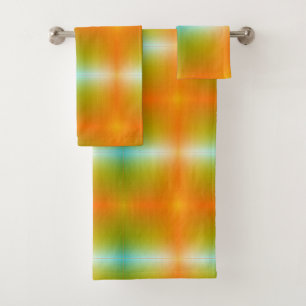Brightly colored towels hang on a silver bar