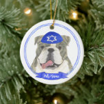 Brindle & White English Bulldog Hanukkah Ceramic Ornament<br><div class="desc">Celebrate your favorite mensch on a bench with a personalized ornament! This design features a sweet illustration of a brindle and white english bulldog dog with a blue and white yarmulke. For the most thoughtful gifts, pair it with another item from my collection! To see more work and learn about...</div>