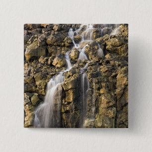 Brine falls from volcanic rock drop off pinback button