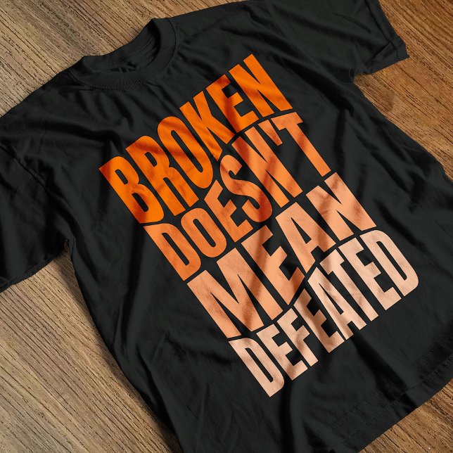 Broken Doesn’t Mean Defeated  T-Shirt (Creator Uploaded)