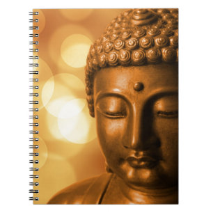 Bronze Buddha Statue with Golden Bokeh Background Notebook