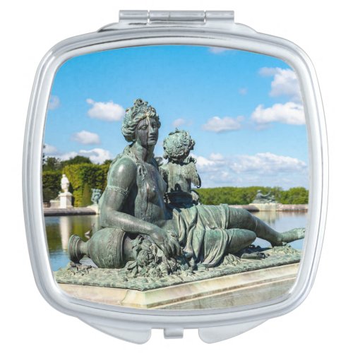 Bronze statue in the garden of Versailles castle Compact Mirror