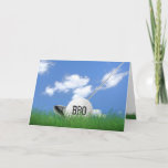 Brother's birthday golf ball in grass card<br><div class="desc">White golf ball in green grass with golf club and sky background for brother's birthday.</div>