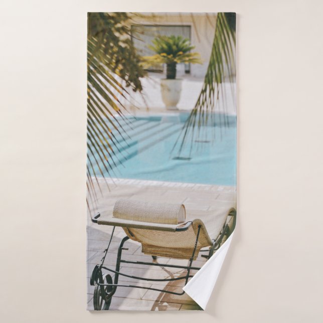 Brown and black armchair beside swimming pool in t bath towel (Bath Towel)