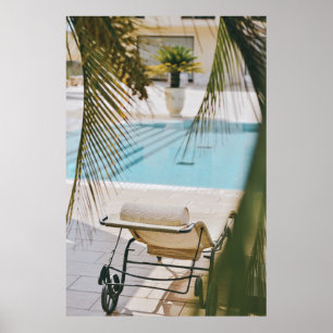 Brown and black armchair beside swimming pool in t poster
