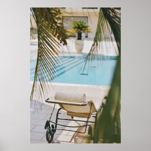 Brown and black armchair beside swimming pool in t poster