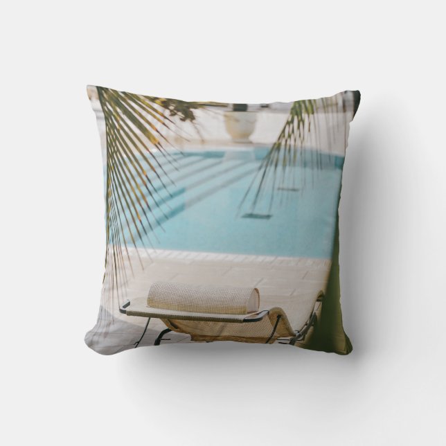 Brown and black armchair beside swimming pool in t throw pillow (Front)
